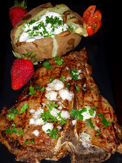A picture of Mike's 10 Minute Rare T-Bone Steak & Baked Potato Dinner.