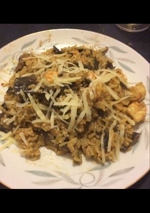 Una foto de Risotto de hongos y langostinos