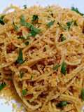 Spaghetti with anchovy butter, crispy crumb and seared lemon