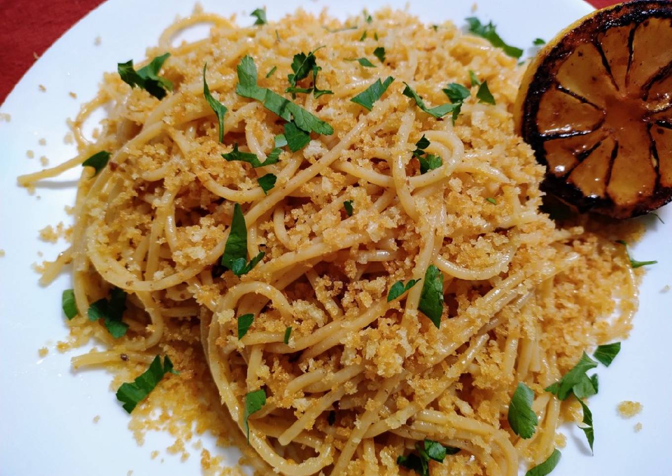 Spaghetti with anchovy butter, crispy crumb and seared lemon