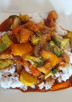 A picture of Chicken Breast in BBQ Sauce over White Rice.