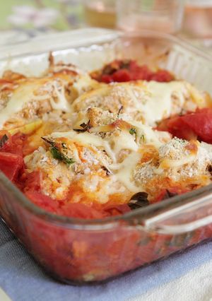 A picture of Roasted Summer Squash Boats Filled with Chicken and Ricotta Topped with Fresh Garlic Tomato Sauce.