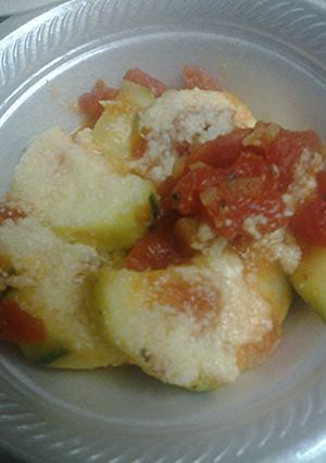A picture of Zucchini and tomato parmesan.