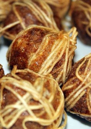 A picture of Deep Fried Meatball Wrapped With Noodle.