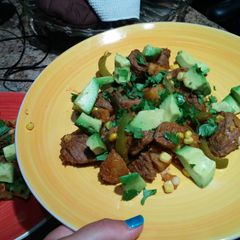 A picture of Mexican-style steak and potatoes..