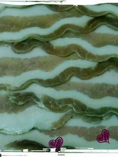A picture of homemade bacon.