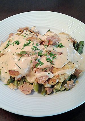 A picture of Chicken with Asparagus, Ham and Bearnaise Sauce.