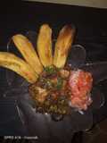 Fried plantains,with beef stew and a side of kachumbari(salsa)