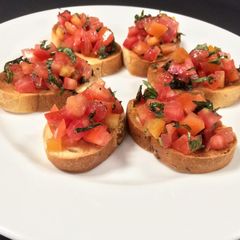A picture of Bruschetta with Tomato.