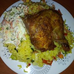 A picture of Fried rice,chicken and salad.