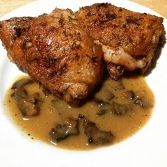 A picture of Roasted Garlic-Rosemary-Thyme Chicken with Shiitake Gravy.