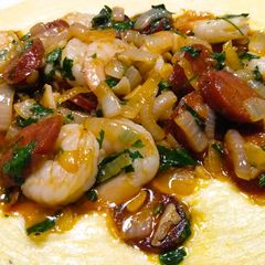 A picture of Prawns and chorizo on polenta.