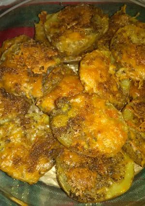 Una foto de Papas al horno con queso y especies