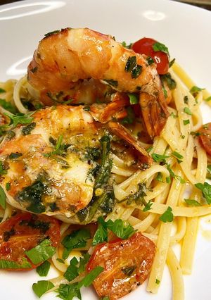 A picture of Spanish garlic tiger prawns with linguine.
