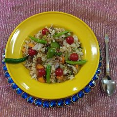 A picture of Rice with mushroom & cherry tomatoes.