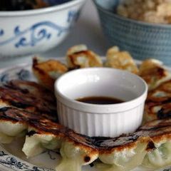 A picture of Crispy Gyoza Dumplings with Bean Sprouts and Garlic Chives.