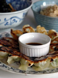 A picture of Crispy Gyoza Dumplings with Bean Sprouts and Garlic Chives.