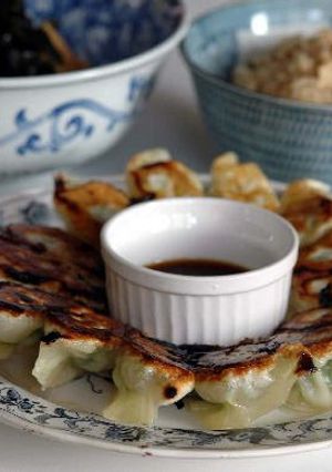 A picture of Crispy Gyoza Dumplings with Bean Sprouts and Garlic Chives.