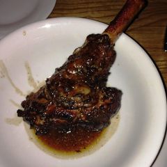 A picture of Lamb Shanks sous vide with rosemary, sage and thyme butter.