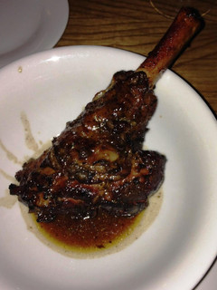 A picture of Lamb Shanks sous vide with rosemary, sage and thyme butter.