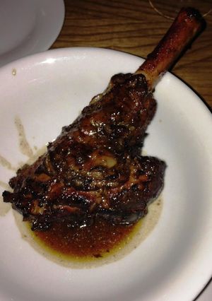A picture of Lamb Shanks sous vide with rosemary, sage and thyme butter.
