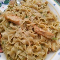 A picture of chicken and broccoli Alfredo.