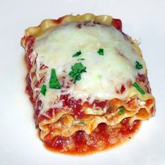 A picture of Hamburger pepperoni mushroom spinach lasagna rolls.