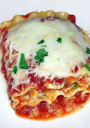 A picture of Hamburger pepperoni mushroom spinach lasagna rolls.