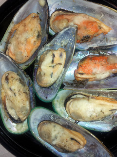 A picture of Mussel parmesan.