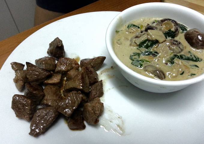 Lamb fillet with mushroom and spinach sauce