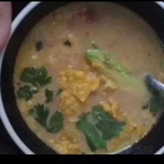 A picture of Cheesy amazing tortilla soup.