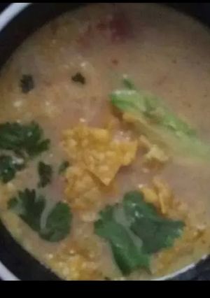 A picture of Cheesy amazing tortilla soup.