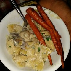 A picture of Chicken Alfredo with Mushrooms.