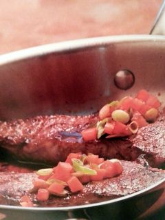 A picture of Kansas city Skillet Stake with Merlot and Plum Tomato Salsa.