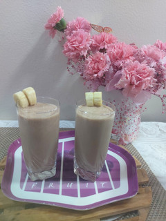 A picture of Banana with chocolate ice cream shake.