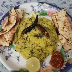 Moong Dal khichadi with Roasted Papad Pickle and Lemon 🍋 A picture of Moong Dal khichadi with Roasted Papad Pickle and Lemon 🍋.