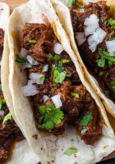 A picture of Fall-Apart Pork Tacos Made in a Wood-Fired Oven.