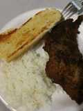 Fried steak with rice and garlic bread
