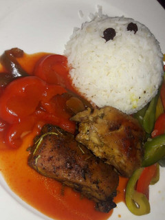 A picture of Grilled chicken with raisin rice.