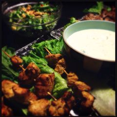 A picture of Green curry chicken kebabs with Minty yogurt sauce.