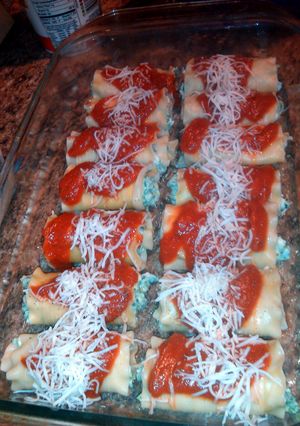 A picture of lasagna rolls sausage & spinach w/ cheese.