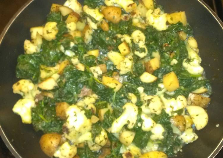Sautee spinach, cauliflower and potatoes
