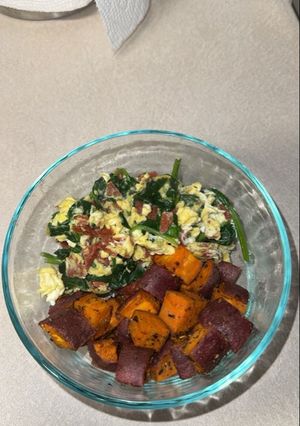A picture of Scrambled Eggs with Spinach and Roasted Sweet Potatoes.