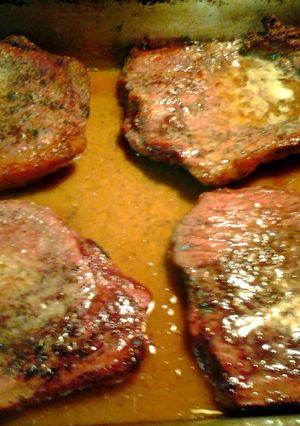 A picture of steak from the oven and gravy.