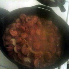A picture of sausage in tomatoe gravy.