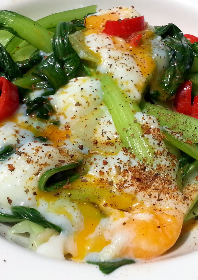 A picture of Bak Choy With Soft Boiled Eggs.