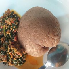 Amala with egusi and ugu leaf A picture of Amala with egusi and ugu leaf.