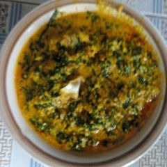 A picture of Egusi soup with stock fish and beef.