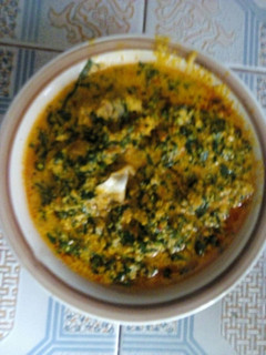 A picture of Egusi soup with stock fish and beef.