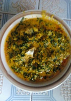 A picture of Egusi soup with stock fish and beef.